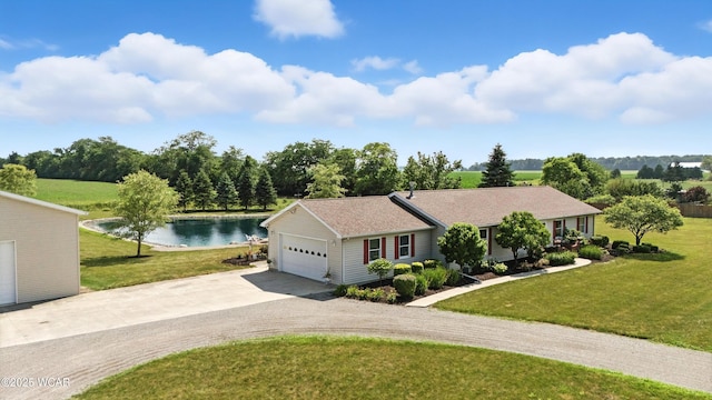 19318 Middle Point Rd, Van Wert, OH 45891 - ranch-style home featuring driveway, a water view, a front lawn, and an attached garage