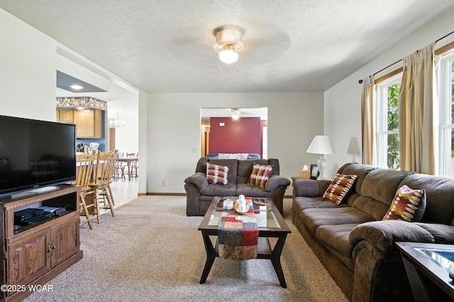 19318 Middle Point Rd, Van Wert, OH 45891 - living room featuring light colored carpet, ceiling fan, a chandelier, and a textured ceiling