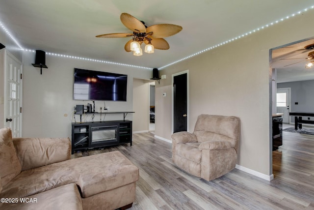 801 S Glenwood Ave, Lima, OH 45805 - living area with a ceiling fan, wood finished floors, and baseboards
