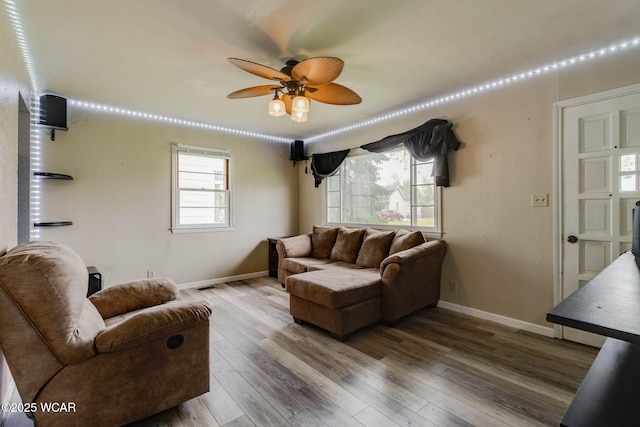 801 S Glenwood Ave, Lima, OH 45805 - living area featuring a ceiling fan, wood finished floors, and baseboards