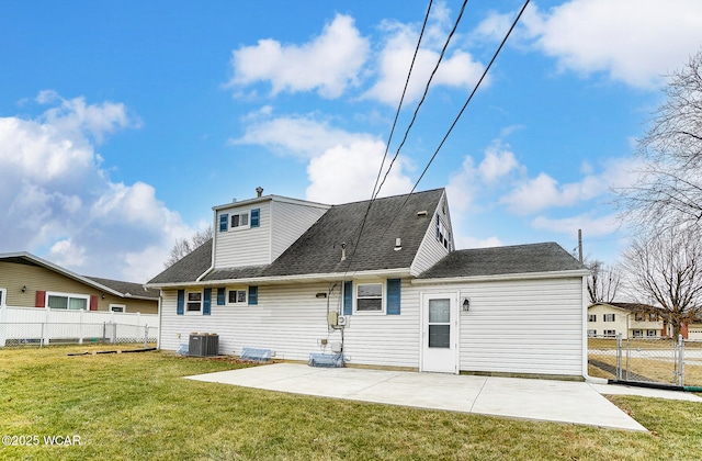 back of property with a yard, central AC, and a patio area