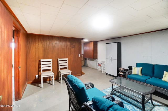 living room with wood walls