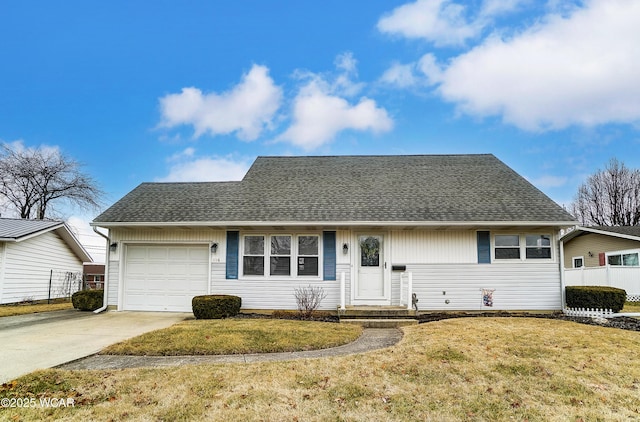 view of front of home featuring a garage and a front yard