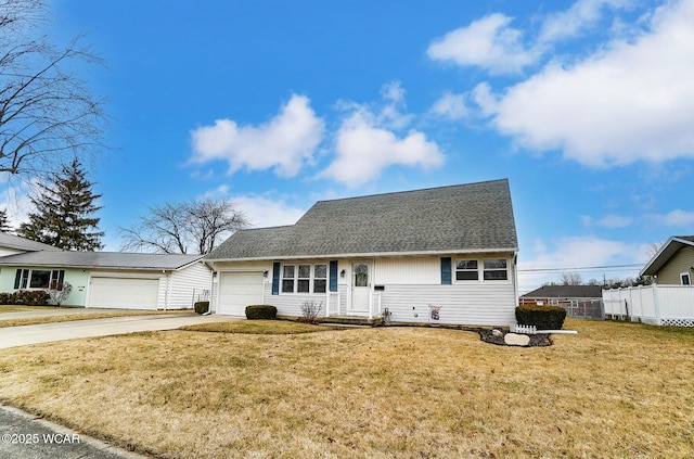 view of front of house with a garage and a front lawn