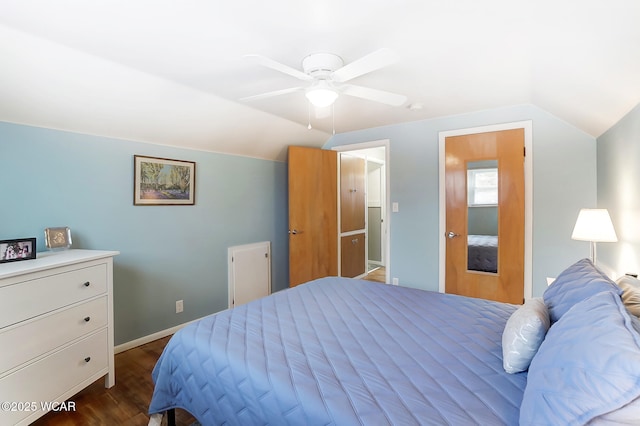 bedroom featuring ceiling fan, lofted ceiling, and dark hardwood / wood-style floors