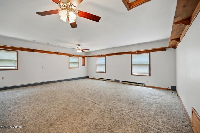 514 S Wayne St, Van Wert, OH 45891 - spare room featuring carpet, a baseboard radiator, baseboards, and ceiling fan