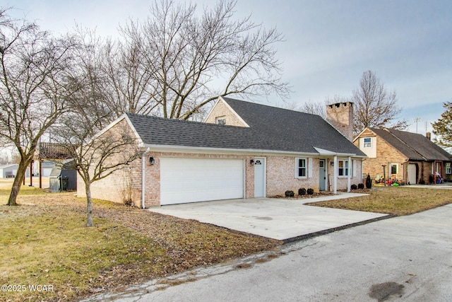 view of front of house featuring a garage and a front yard