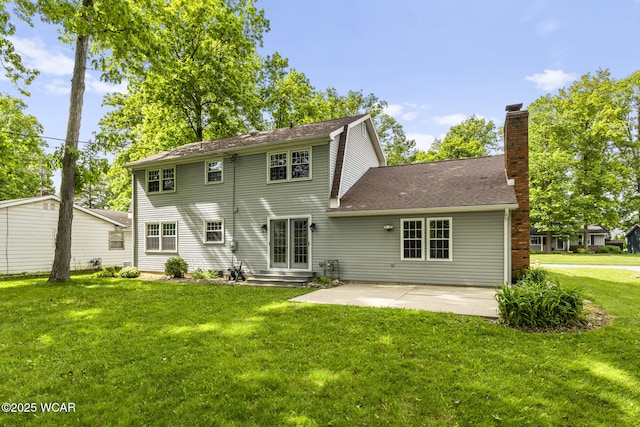 120 Barnsbury Dr, Lima, OH 45804 - back of property with a patio area, a yard, and a chimney