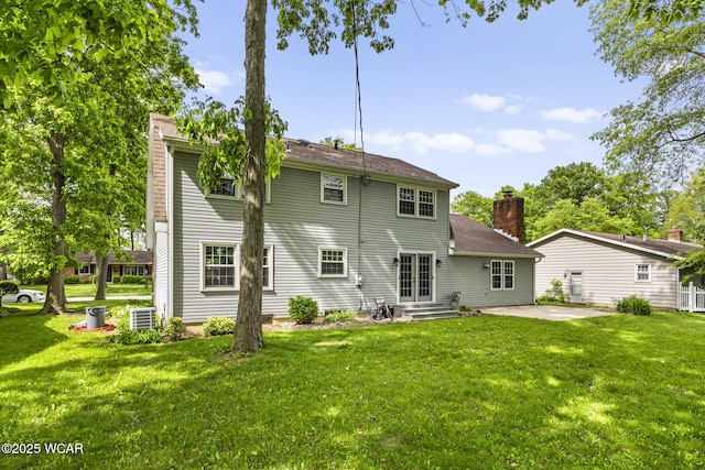 120 Barnsbury Dr, Lima, OH 45804 - rear view of property featuring a patio area, a yard, central air condition unit, and entry steps