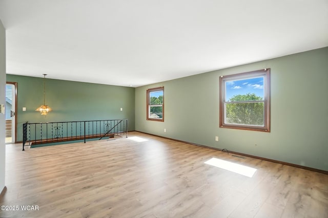 591 Monticello Ave Unit A, Lima, OH 45804 - spare room with wood finished floors and baseboards