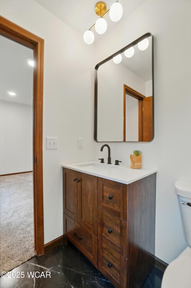 1257 Timberlane Dr, Lima, OH 45805 - bathroom featuring vanity, toilet, and baseboards