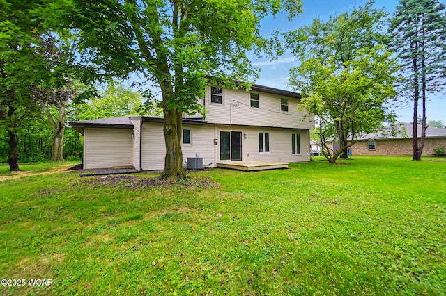 1257 Timberlane Dr, Lima, OH 45805 - back of property with cooling unit, a lawn, and a deck