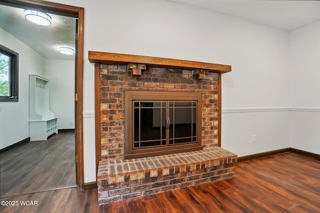 1257 Timberlane Dr, Lima, OH 45805 - detailed view of wood finished floors, baseboards, and a brick fireplace