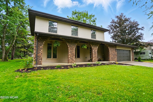 1257 Timberlane Dr, Lima, OH 45805 - view of front of house with covered porch, brick siding, driveway, a garage, and a front lawn