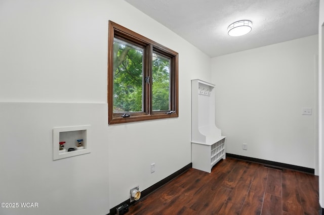 1257 Timberlane Dr, Lima, OH 45805 - washroom featuring dark wood finished floors, washer hookup, and baseboards
