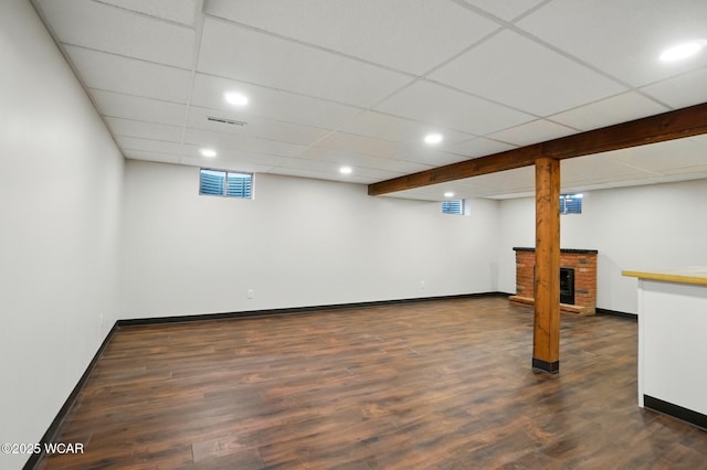 1257 Timberlane Dr, Lima, OH 45805 - basement featuring baseboards, dark wood-style floors, recessed lighting, and a paneled ceiling