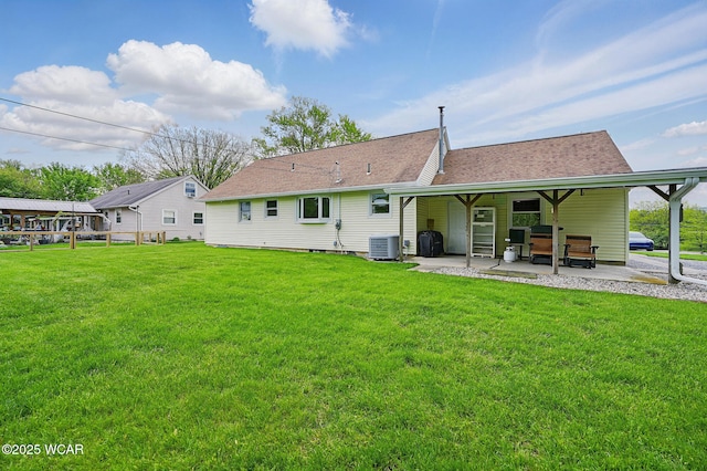 5712 Poling Rd, Elida, OH 45807 - back of house featuring central AC unit, a yard, a patio, and a shingled roof