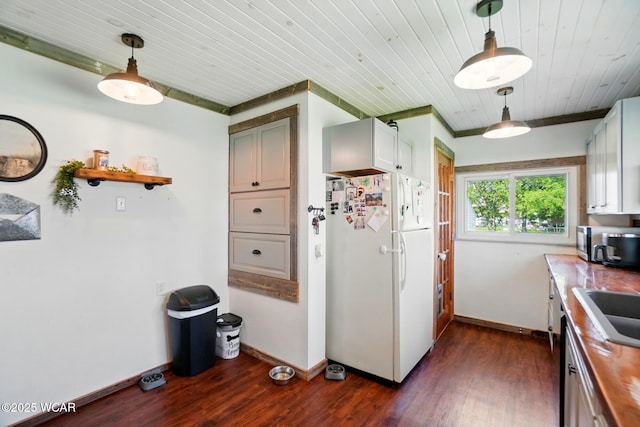 227 N Clay St, Delphos, OH 45833 - kitchen with freestanding refrigerator, wooden ceiling, baseboards, dark wood-style flooring, and decorative light fixtures