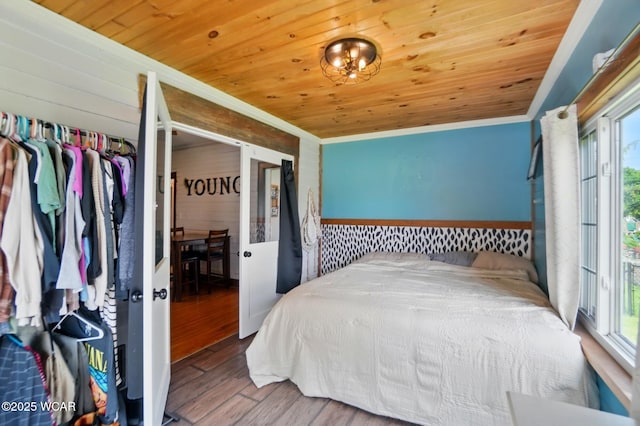 227 N Clay St, Delphos, OH 45833 - bedroom with ornamental molding, wooden ceiling, wood finished floors, and wooden walls