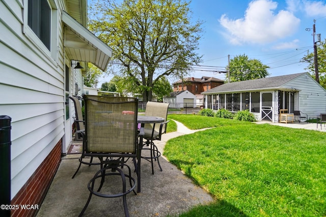 227 N Clay St, Delphos, OH 45833 - view of yard with a patio area, outdoor dining space, and a sunroom