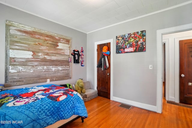 227 N Clay St, Delphos, OH 45833 - bedroom featuring wood finished floors, baseboards, and crown molding