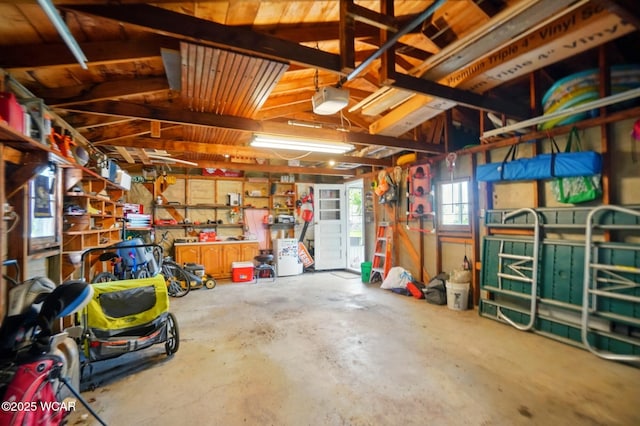 227 N Clay St, Delphos, OH 45833 - garage featuring a garage door opener and a workshop area