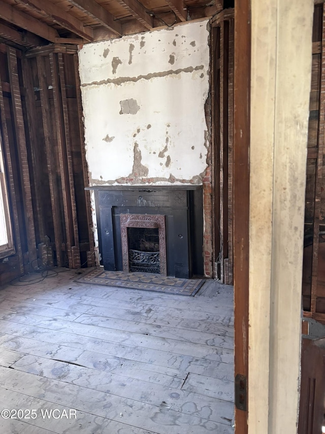 miscellaneous room featuring hardwood / wood-style floors and a fireplace