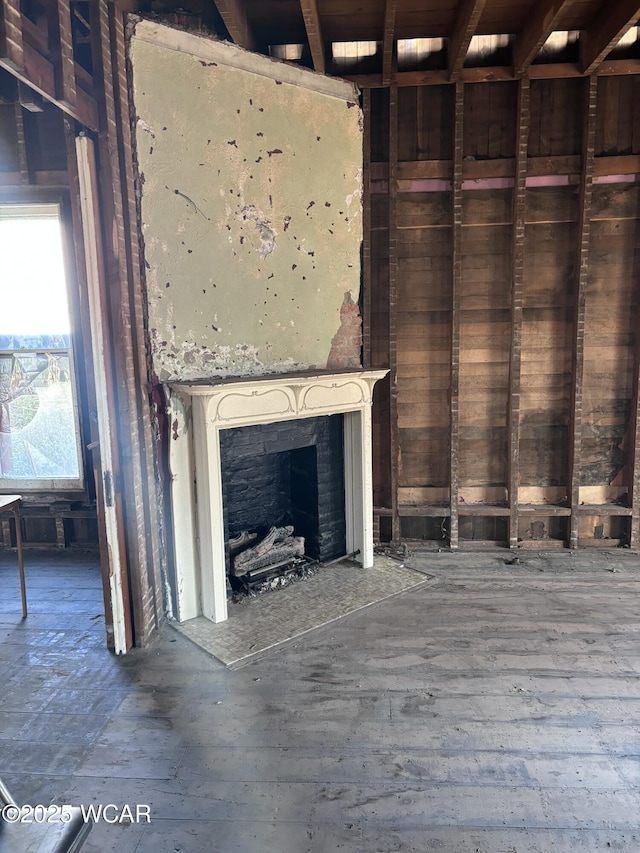 unfurnished living room featuring a high end fireplace