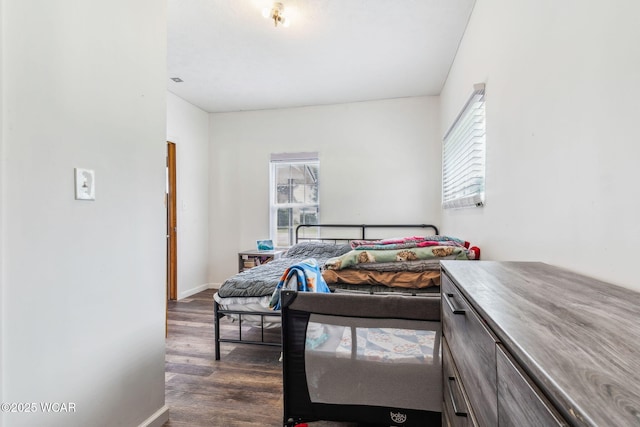514 W Taylor St, Mount Victory, OH 43340 - bedroom with dark wood-style floors and baseboards