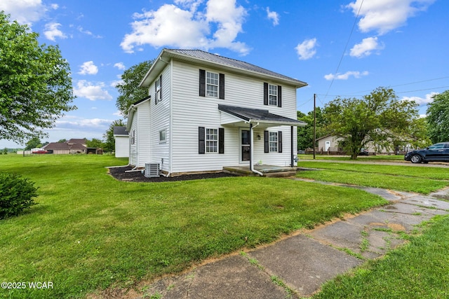 514 W Taylor St, Mount Victory, OH 43340 - traditional home with a front yard and a metal roof