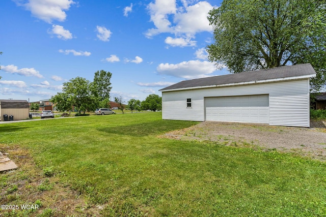 514 W Taylor St, Mount Victory, OH 43340 - view of green lawn with an outbuilding and a garage