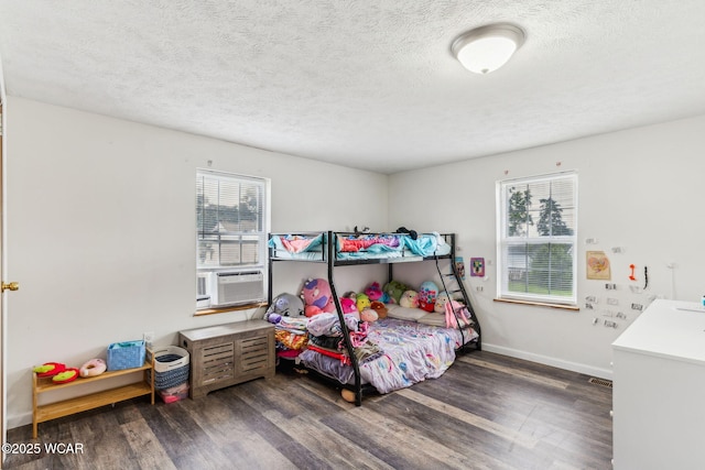 514 W Taylor St, Mount Victory, OH 43340 - bedroom featuring cooling unit, wood finished floors, and a textured ceiling
