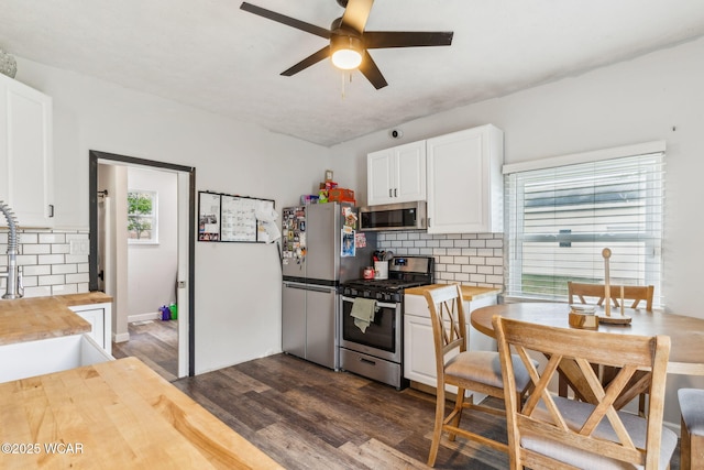 514 W Taylor St, Mount Victory, OH 43340 - kitchen with wood counters, stainless steel appliances, and tasteful backsplash