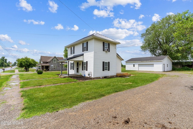 514 W Taylor St, Mount Victory, OH 43340 - view of front of home with an outdoor structure, a detached garage, a front yard, and dirt driveway