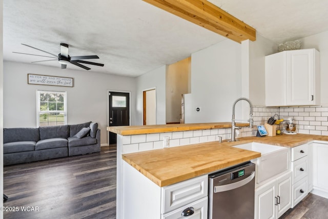 514 W Taylor St, Mount Victory, OH 43340 - kitchen featuring butcher block counters, dishwasher, a peninsula, open floor plan, and tasteful backsplash