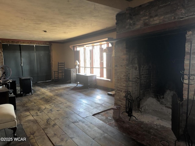 living room featuring wood-type flooring and crown molding