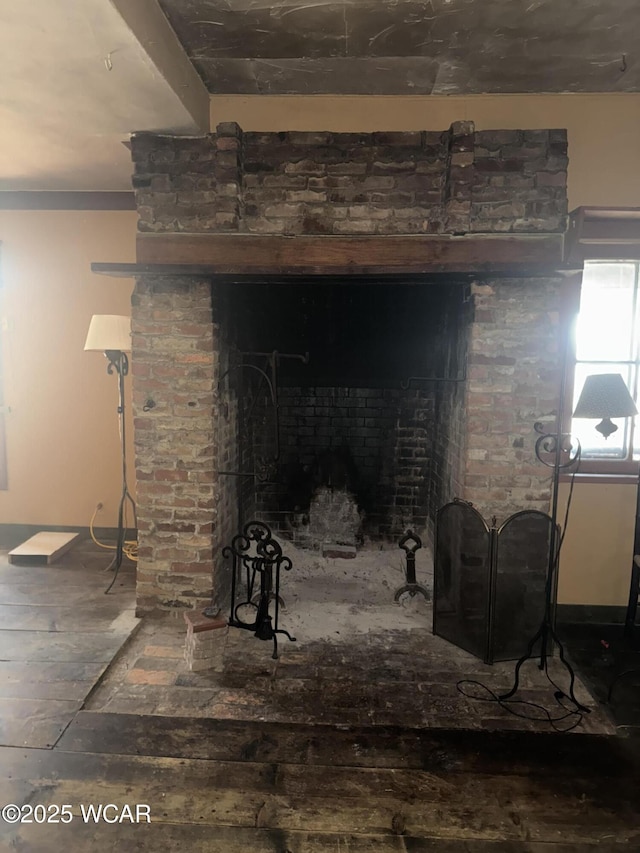 interior details featuring wood finished floors and a fireplace