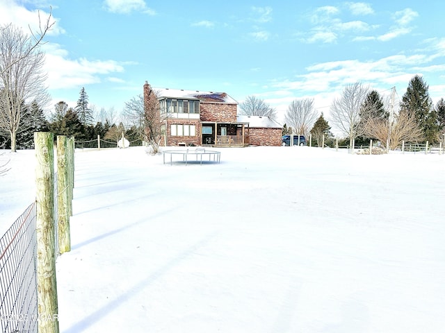 view of snow covered property