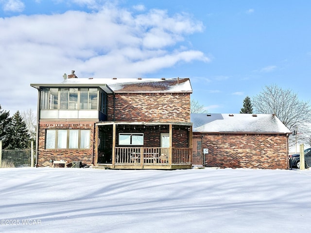 view of front of house featuring a sunroom