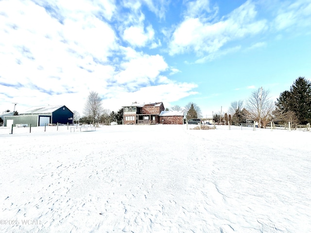 view of yard layered in snow