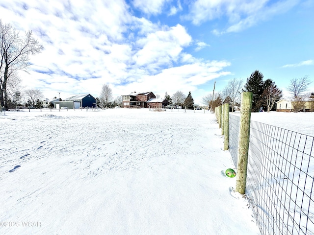 view of yard layered in snow