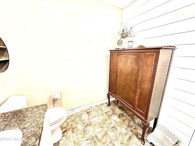 bathroom featuring sink and toilet