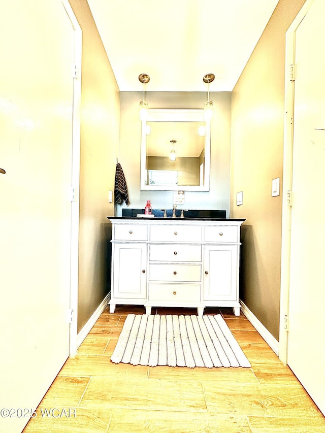 bathroom featuring hardwood / wood-style flooring and vanity