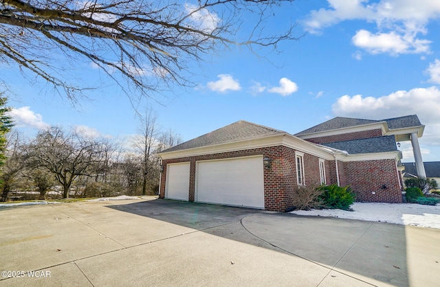 view of side of property with a garage