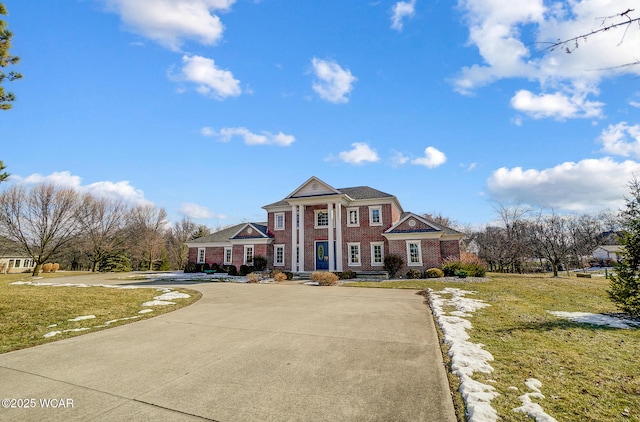 greek revival house with a front yard