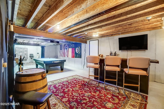 playroom with pool table, bar area, and concrete flooring