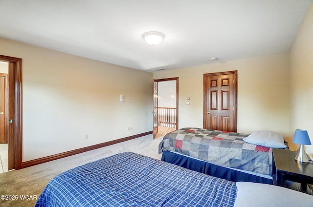 bedroom featuring light carpet