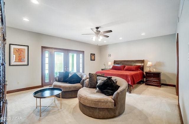 carpeted bedroom with french doors and ceiling fan