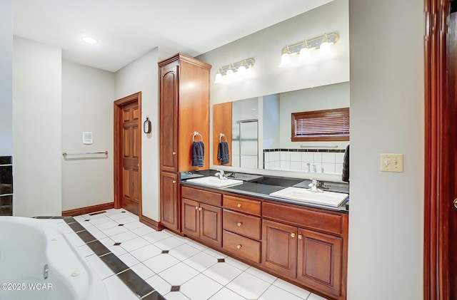 bathroom featuring vanity, a washtub, and backsplash