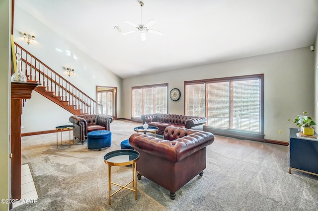 living room featuring a healthy amount of sunlight, carpet floors, ceiling fan, and high vaulted ceiling